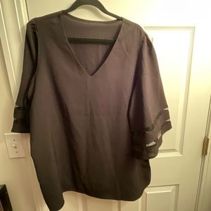 Black blouse with sheer stripes on sleeves
